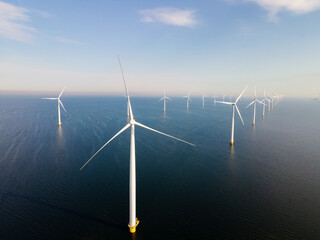 Offshore Windmill farm in the ocean Westermeerwind park , windmills isolated at sea on a beautiful...