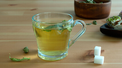 green tea mug over wooden table
