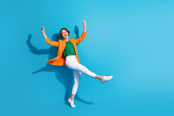 Fototapeta na wymiar Full size cadre of youngster business investor woman celebrate her startup growing progress dancing isolated on blue color background