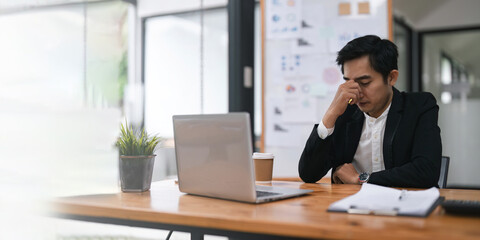 Overworked businessperson financier while working are stress the outcome