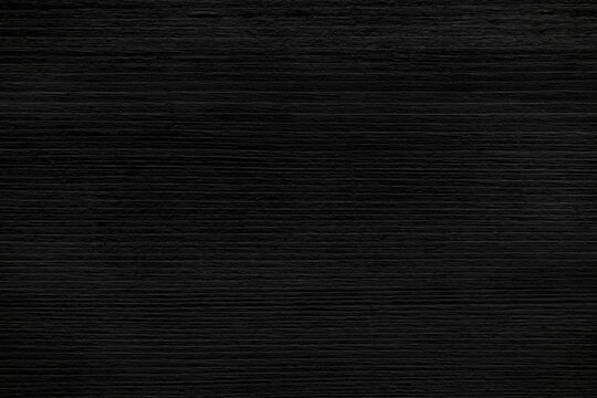 Black old wood texture background.  Rough and grunge texture.  Vintage style wooden backdrop. 