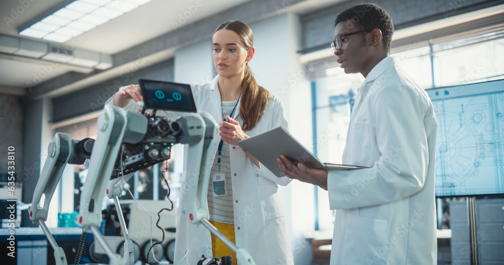 Aufkleber Two Multiethnic Industrial Robotics Specialists Working on a Mobile Robot, Using Laptop. Black Male Young Engineer In Lab Coat Discussing an Automated AI Robotic Dog with his Female Project Supervisor