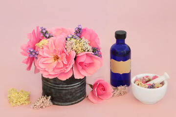 Tranquilizing adaptogen flowers wildflowers and herbs used in natural herbal medicine with rose, valerian, elder and lavender flora. Alternative remedy on pink background.
