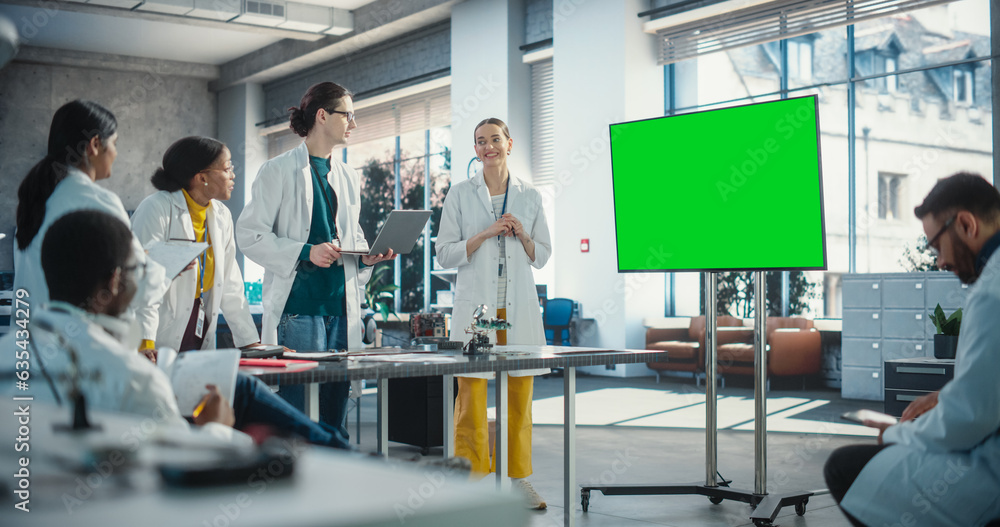 Aufkleber group of students listening to their robotics female professor who uses green screen monitor in a la