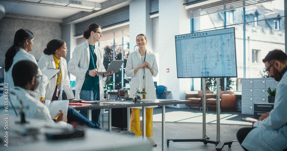 Poster Multiethnic Team of Males and Females Discussing Ideas in Technological Startup Lab. Group of International Students Listening to Their Female Robotics Professor While She Explains AI Robot Blueprints