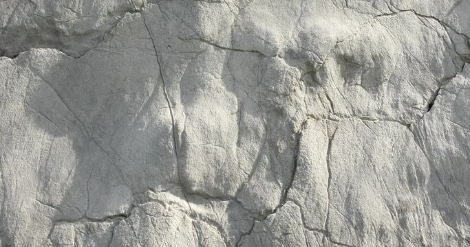 The texture of the stone close-up. Rough rock wall. High quality 4k footage