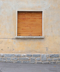 Fototapeta na wymiar Residential house protected by a metal shutter