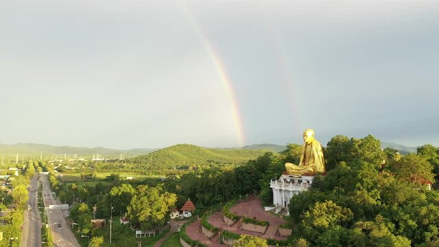 Aerial view The Rainbow and Kruba Srivichai statue at Wat Doi Ti the old history temple in Lumphun, Thailand.