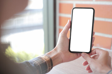 cell phone blank white screen mockup.hand holding texting using mobile on desk at office.background empty space for advertise.work people contact marketing business,technology