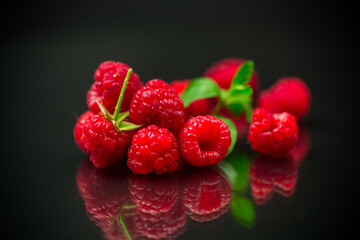 Sweet raspberry fruit isolated on black background