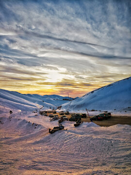 Snowy Road on snow covered mountains in Faraya, Lebanon during sunset