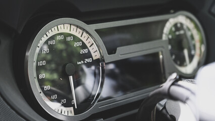 Speedometer on a motorcycle, close up.