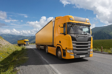 semi truck driving through mountain road pass - 635466259