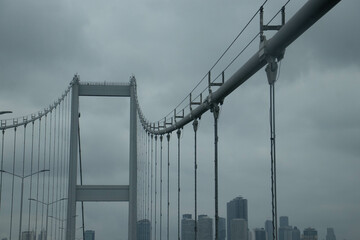 Suspension machinery bridge, beautiful view of the bridge in Istanbul. Traffic of cars in the city.