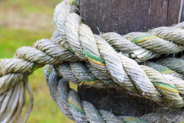 Fototapeta na wymiar close up of a rope knot on post