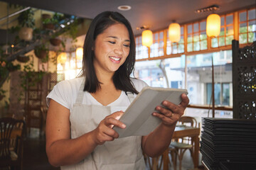 Restaurant, tablet and woman for online for service, inventory and check food menu. Coffee shop, small business and happy waitress, barista or manager on digital tech for cafe website or payment app
