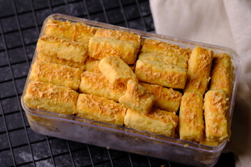 Kaasstengels kastengel or Cheese Cake is Indonesian cheese stick cookies, made from cheese, wheat flour, salt, butter, and eggs. Popular during Hari Raya Lebaran in Indonesia. Indonesian food.