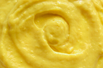 Yellow mustard sauce texture background.