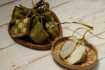 Ketupat is a typical Javanese dish made from rice which is wrapped in a wrapper made of woven young coconut leaves. Kupat, tupat, topat, tipat. 