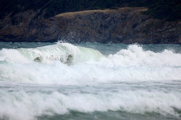 Abstract landscape with sea waves at the shore on a windy day.