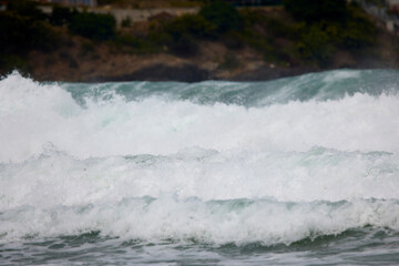 Abstract landscape with sea waves at the shore on a windy day.