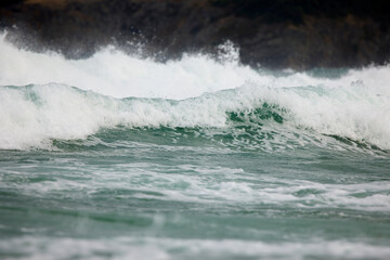 Abstract landscape with sea waves at the shore on a windy day.