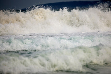 Abstract landscape with sea waves at the shore on a windy day.