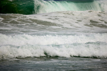 Abstract landscape with sea waves at the shore on a windy day.