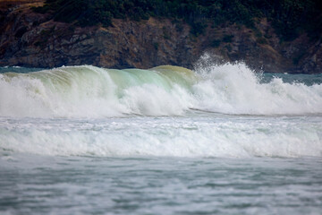 Abstract landscape with sea waves at the shore on a windy day.