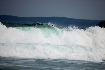 Abstract landscape with sea waves at the shore on a windy day.