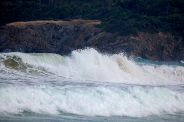 Abstract landscape with sea waves at the shore on a windy day.