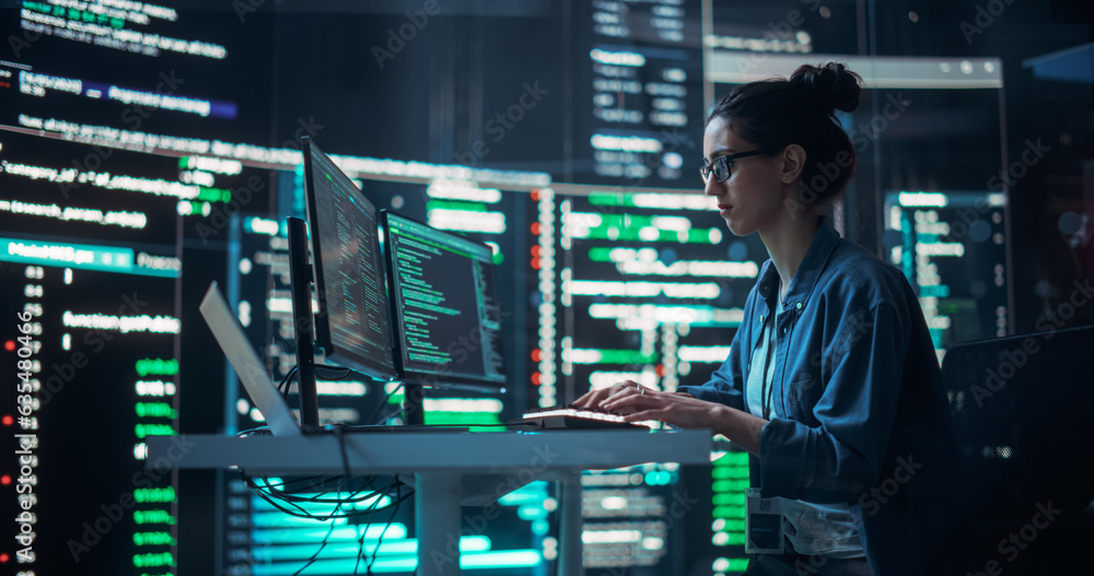 Poster Portrait of a Woman Working on Computer, Typing Lines of Code that Appear on Big Screens Surrounding her in a Monitoring Room. Female Programmer Creating Innovative Software Using AI Data and System