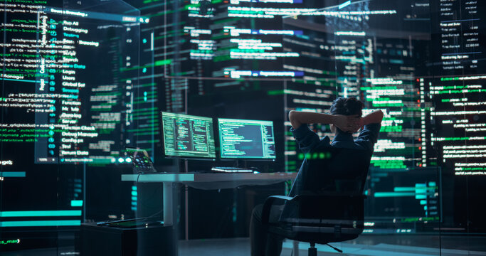 Female Developer Happily Resting After Successfully Typing on Computer Properly Functioning Back-end Code. Professional Programmer Surrounded by Big Screens Showing Coding Language, Creating Software.