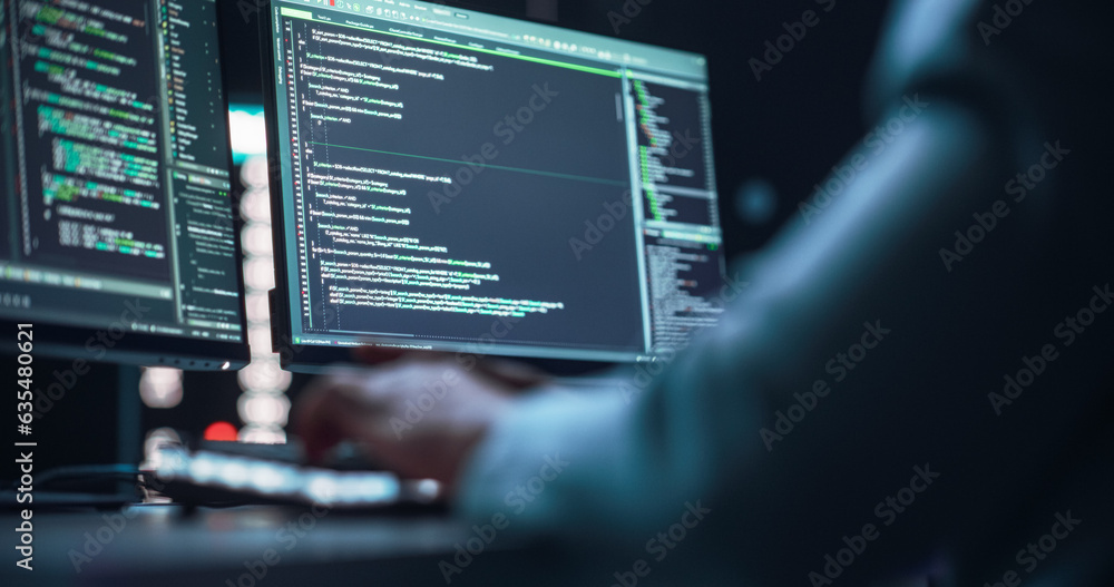 Aufkleber Close Up on Black Male Hands Typing on a Desktop Computer Keyboard In Dark Network Security Office. Professional Programmer Writing Code Displayed on Two Monitor Screens. High Tech Developing Concept.