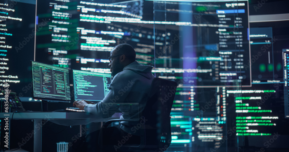 Fototapete Shot of a Man Working as a Developer, Surrounded by Big Screens Displaying Lines of Code in a Monitoring Room. Black Male Programmer Using Desktop Computer, Analysing Data, Creating AI Software