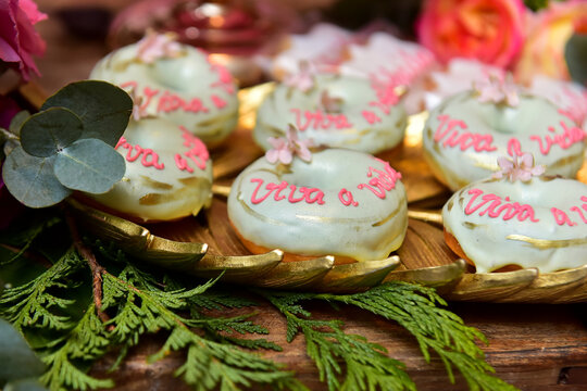 christmas donuts on a table, donuts, donut ring, fluffy donuts,cream donuts, "live life" text, text donut, edible donuts, party candy, candy table, personalized candies, candy shop