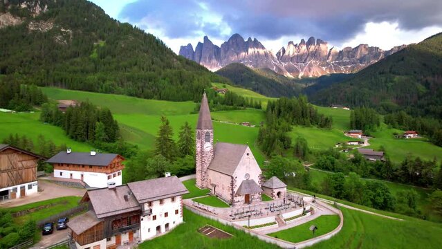 4K Cinematic Aerial Flyover: Santa Maddalena Church in Val di Funes, Iconic Odle Mountains Peaks Background, Autumn in Dolomites, South Tyrol Alto Adige Italy Travel Video
