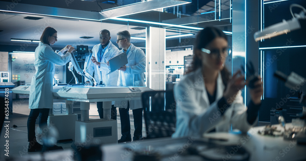 Aufkleber Female Engineer Fixing a High-Tech Bionic Hand Component. On Background Proffesional Industrial Robotics Specialists in Lab Coats Working on a Mobile AI Robot in a Tech Factory Facility.