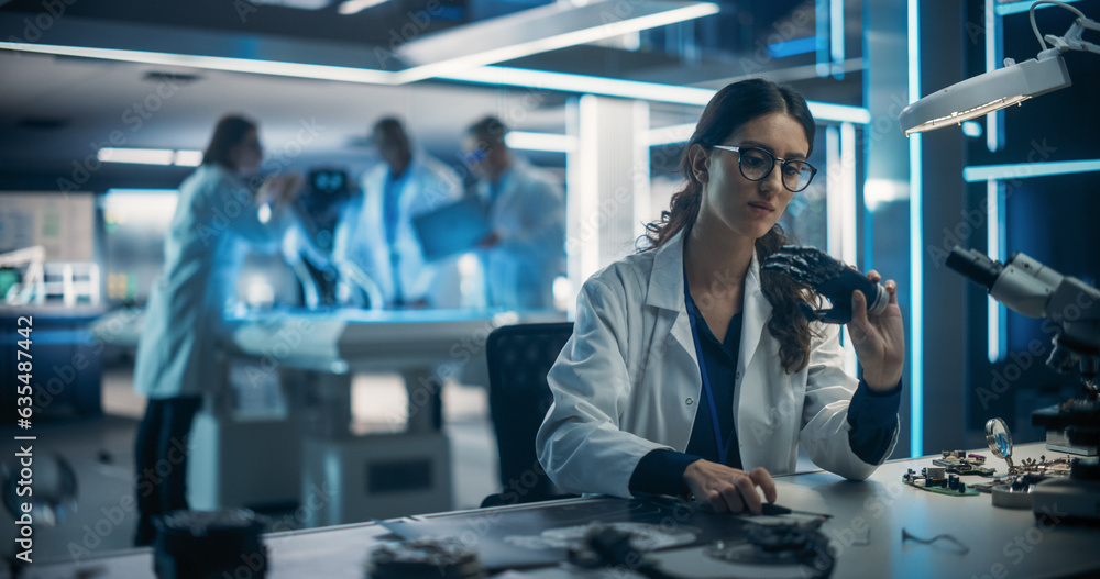 Poster Research and Development Facility with Engineers Working on a High Mobility Robot Dog Project. On Foreground Female Scientist Developing a Prosthetic AI Powered Robotic Hand at Her Desk
