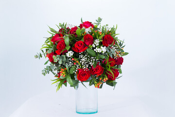 Many kinds of beautiful flowers put in vase on a white background