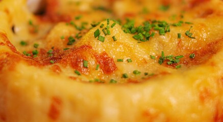 soup en croute with puff pastry crust and chopped green onion close up view texture