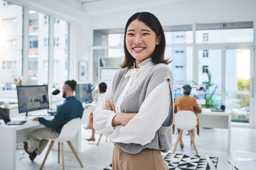 Happy, woman and Asian employee with arms crossed in office, workplace and confident in working for...
