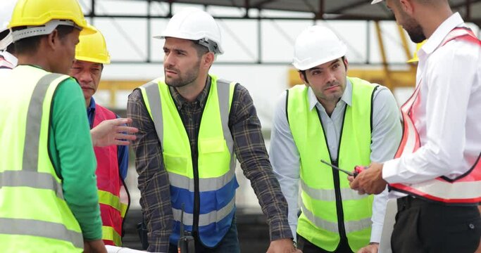 Success teamwork. Ethnic diversity worker people. Group of professional Construction engineering people wearing hardhat safety helmet meeting at Prefabricated concrete walls Industry Factory