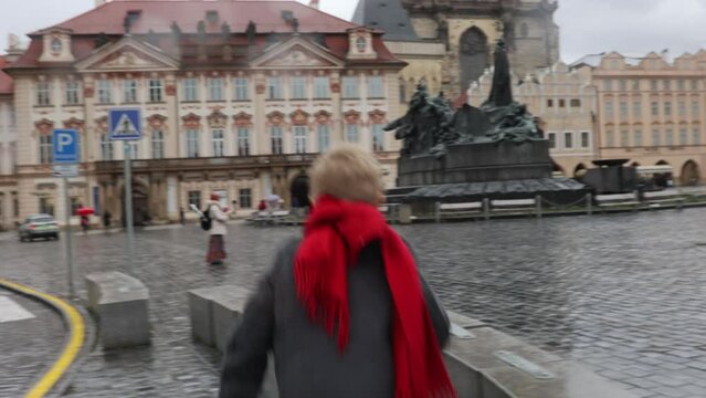 Child in the center of Prague, eating traditional czech dessert trdelnik in the city center