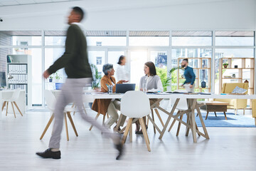 Business people, walking and busy in meeting, planning and collaboration in office or workspace for startup or project. Professional worker, employees or group in speed or blur for creative teamwork