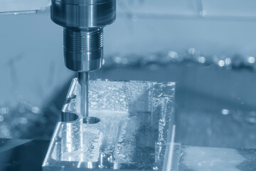 The CNC milling machine rough cutting the aluminum housing with flat end mill tool.
