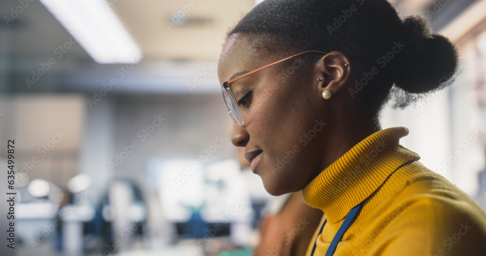 Aufkleber young smart african american female student studying in modern school with diverse multiethnic class