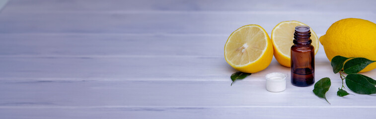 lemon oil in jars, fresh lemon. Selective focus.