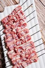 Raw lamb skewers on a plate