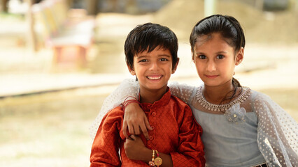 Little kids wearing tradional indian dress enjoying Indian festival. Children in ethnic wear looking at camera